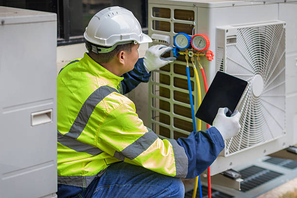 Professional Air Conditioning Repair technician working in Newton Upper Falls, MA